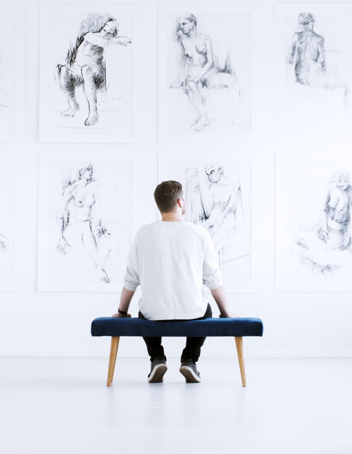 Man relaxing in art gallery